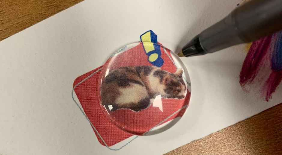 Tracing circle of a cat with an exclamation point on a red background